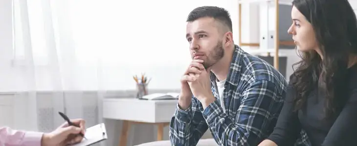 Young married couple consulting with a mediator for their divorce proceedings